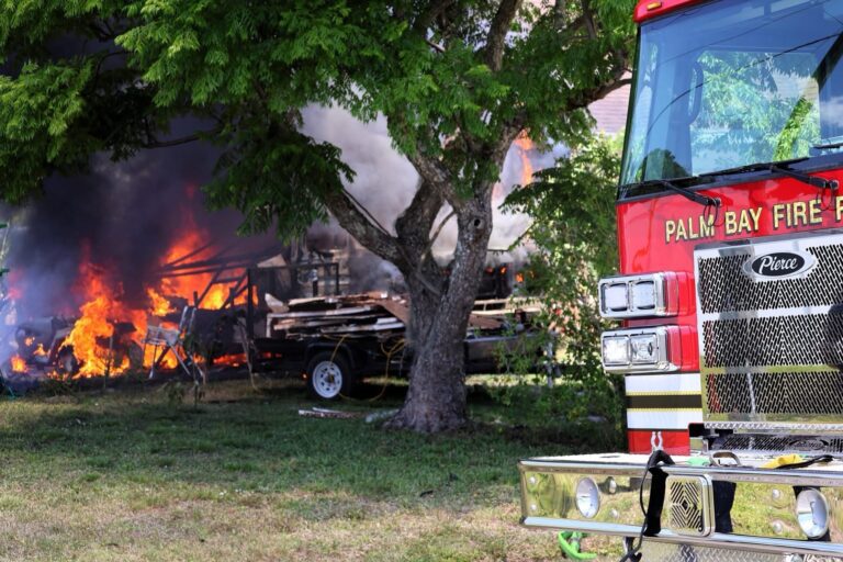 Engulfed Camper Catches Palm Bay Home on Fire